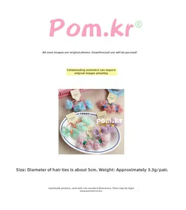 Detailed view of floral bow hair ties in five pastel colors on a woven tray