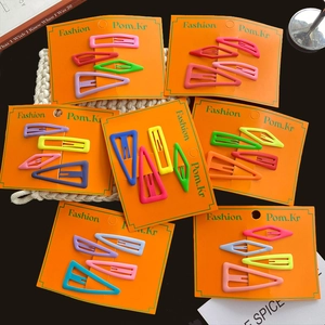 Matte geometric hair clips in vibrant candy colors, including drop and square shapes