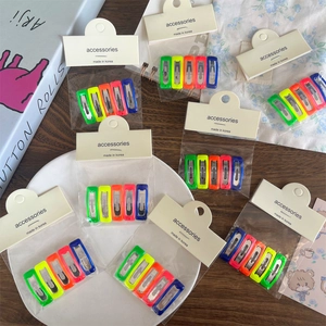 5-pack colorful candy-colored rectangular hair clips set on a stylish lifestyle background