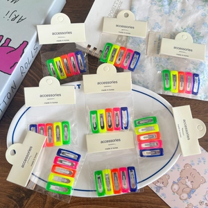 5-piece set of vibrant candy-colored rectangular hair clips on a stylish display card