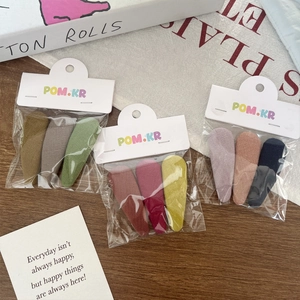 Three-piece fabric hair clips set with duckbill design and textured linen finish