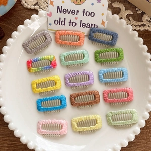 Set of 15 colorful fabric-wrapped dog hair clips in vibrant candy colors for pets