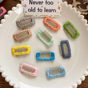 Set of ten colorful woven fabric hair combs in sweet candy colors for dogs and women