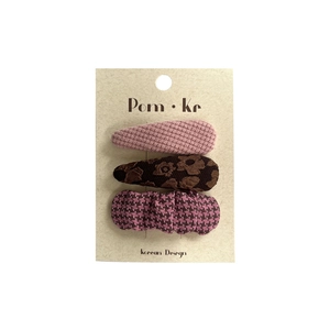 Three-piece floral and plaid fabric hair clip set for girls on white background
