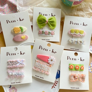 Pastel Korean style hair clip set featuring lace ribbons, embroidery, and pearls