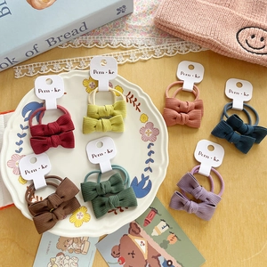 Bow hair ties in various colors with high elasticity on white display cards