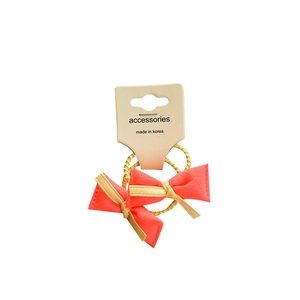 Neon orange bow hair ties set with yellow spiral elastic bands on card display