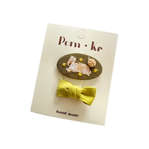 Sweet embroidered rabbit and yellow bow hair clips set for girls on card display