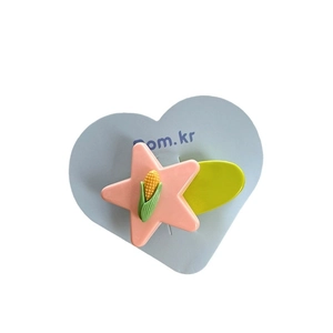 Candy-colored star hair clip with corn design on blue heart-shaped card for girls