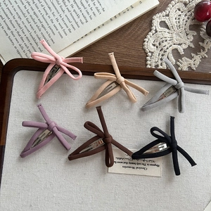 Set of 6 colorful Korean fabric bow hair clips for women in a vintage wooden tray