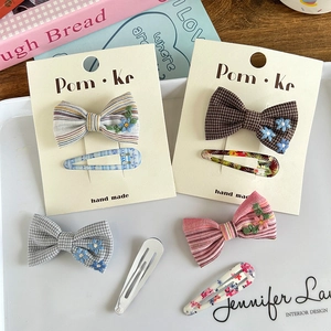 Bow hair clip set with floral embroidery and plaid patterns for women and girls