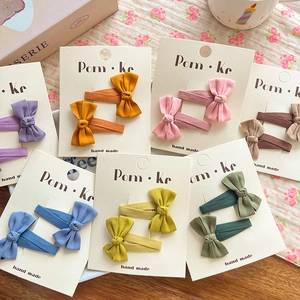 Bow knot fabric hair clip set for women in various vintage colors on display cards