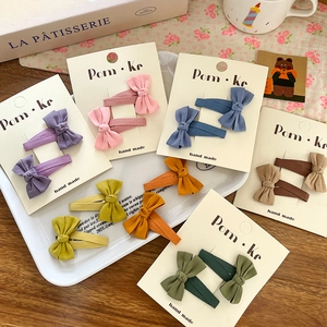 Elegant Korean bow hair clip set in seven assorted colors on handmade cardboards