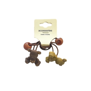 Elastic bear hair ties with golden rhinestones on a yellow paper packaging card