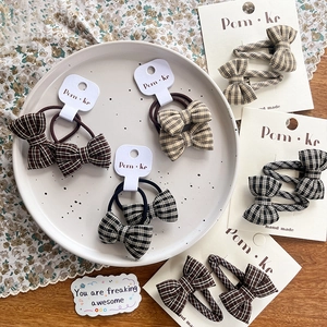 Plaid bow hair ties and clips set in brown, beige, and black fabric for kids