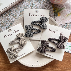 Three-piece set of handmade plaid bow hair clips for kids in neutral autumn tones