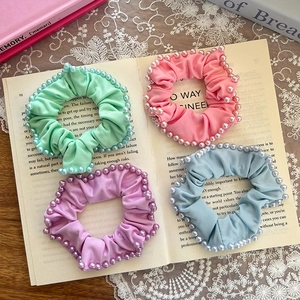 Set of four pastel satin scrunchies with pearls in mint, pink, purple, and blue colors