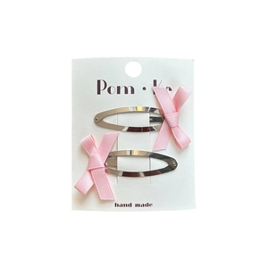 Set of two pink ribbon bow hair clips with silver metallic finish on white display card