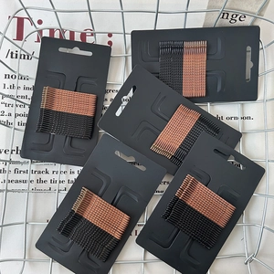 Set of minimalist black and brown wavy hairpins on card for daily styling