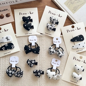 Bow and heart hair clip set with black and white polka dots and floral patterns