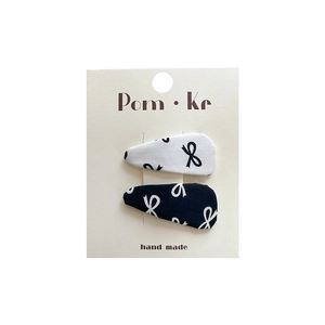 Set of two handmade fabric bow hair clips in black and white polka dot patterns