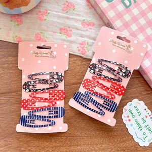 Water-drop hair clips set with floral, polka dot and stripe prints on display card