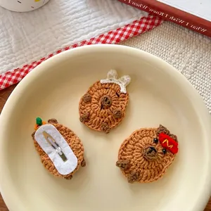 Handmade knitted Capybara hair clips with cute bows and embroidery in a warm set