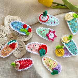 Handmade crochet fruit hair clips set featuring cute strawberry and cherry designs