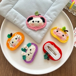 Handmade crochet hair clips for girls featuring cute animal designs in a ceramic plate