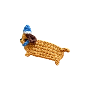 Handmade crochet dachshund hair clip in caramel brown with blue pointy hat for girls