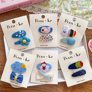 Handmade 12-piece kids hair clip set with cute felt animals, flowers and rainbow patterns