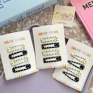 Polka dot star and teardrop shape hair clips set for girls in black and white pattern