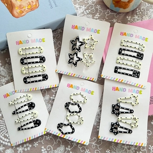 Set of Korean style polka dot hair clips in star and teardrop shapes on lace