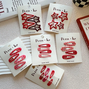 Red floral drip glue BB hair clips set with stars and polka dots on display cards