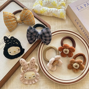 Set of cute velvet floral and plaid bow hair ties featuring rabbit and blossom designs