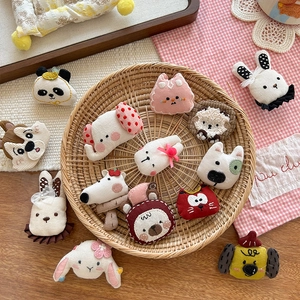 Cute embroidered cartoon animal brooches in a woven tray for clothes and bag decor