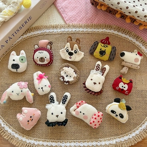 Handmade cute 3D fabric cartoon animal pins featuring bears and rabbits on a lace mat