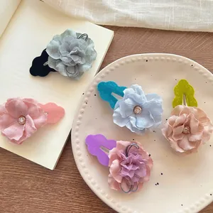 Elegant floral hair clips with crystals and soft fabric petals in five pastel colors