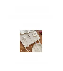 Detail view of lace embroidery hairbands with floral patterns and delicate white ribbons