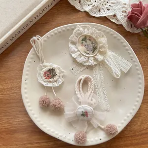 Floral lace embroidery hair accessories set in a vintage ceramic dish with dried flowers