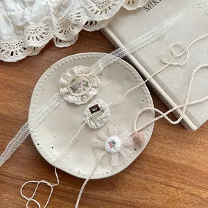 Detailed close-up of handmade lace flower embroidery hair clips and floral headbands