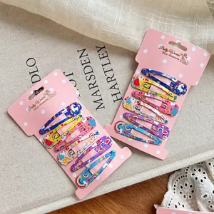 Cartoon pattern BB hair clips set with rainbow and unicorn prints on pink card