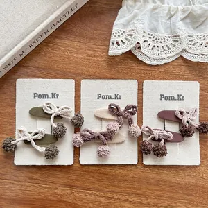 Ensemble de barrettes à nœuds tricotés et pompons pour filles aux tons terreux