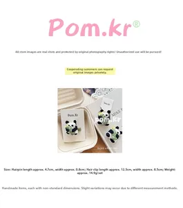 Detailed set of three plush panda hair clips with knitted heart and bamboo motifs