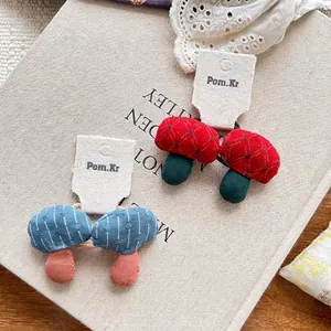 Handmade 3D mushroom fabric hair ties set with red dots and blue stripes patterns