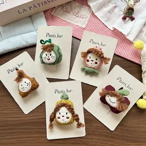 Cute fruit fabric hair clips set with handmade embroidery on decorative wood surface