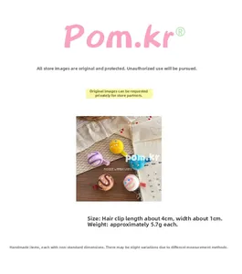 Detail showing 4cm wool felt hair clips in five colors with dimensions on wood surface