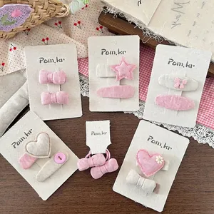 Niedliches Set aus rosa Stoff-Haarspangen mit Herz-, Stern- und Schleifendesign für Mädchen