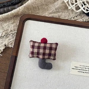 Detail of red gingham fabric doll charm with wine red pompom and vintage grey hook