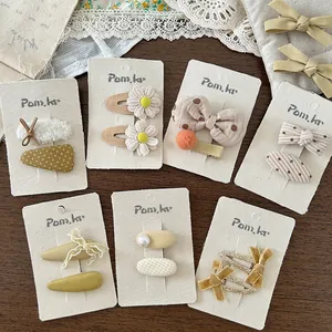 7-teiliges Set koreanischer Haarspangen für Mädchen mit Blumen in Creme und Gelb